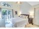 Tranquil bedroom featuring high ceilings and a private balcony with beautiful tree views at 4403 Sea Forest Dr, Kiawah Island, SC 29455