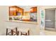 This modern kitchen features granite counters, stainless appliances, and a breakfast bar at 4403 Sea Forest Dr, Kiawah Island, SC 29455
