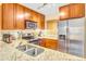 Bright kitchen features granite counters, stainless appliances, and ample wooden cabinets at 4403 Sea Forest Dr, Kiawah Island, SC 29455