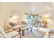 Inviting living room offers bright natural light and access to a private outdoor deck at 4403 Sea Forest Dr, Kiawah Island, SC 29455