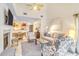 Cozy living room with a fireplace and views into the adjoining kitchen and dining area at 4403 Sea Forest Dr, Kiawah Island, SC 29455
