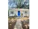 Charming single-story home with a blue front door, gray shutters, and a well-manicured front yard at 4406 Holmes Ave, North Charleston, SC 29405