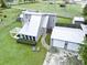 Aerial view of property with large yard, detached garage, and patio at 49 Auld Brass Rd, Walterboro, SC 29488
