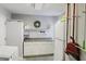 Functional laundry room with white cabinetry, countertop space, and convenient storage at 49 Auld Brass Rd, Walterboro, SC 29488