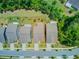 Aerial view of homes with well-manicured lawns and mature trees at 5078 Song Sparrow Way, Summerville, SC 29483