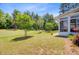 Well-maintained backyard with lush green grass, privacy fence and view of sunroom at 5078 Song Sparrow Way, Summerville, SC 29483
