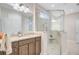 Beautiful bathroom with glass-walled shower, a large mirror, and sleek vanity with storage at 5078 Song Sparrow Way, Summerville, SC 29483