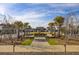 Beautifully landscaped community park with fountain, walking paths, and manicured lawns at 5078 Song Sparrow Way, Summerville, SC 29483