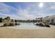Large community swimming pool with a zero entry, palm trees, sun, and beautiful blue skies at 5078 Song Sparrow Way, Summerville, SC 29483