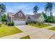 Charming single story home with landscaped yard and a two car garage at 5078 Song Sparrow Way, Summerville, SC 29483