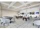 Well-appointed game room with pool tables, card tables, and comfortable seating areas at 5078 Song Sparrow Way, Summerville, SC 29483