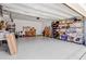Spacious garage featuring ample storage and a well-organized workshop area with tools and shelves at 5078 Song Sparrow Way, Summerville, SC 29483
