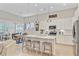 Bright open kitchen boasts granite counters, a center island, and stainless steel appliances at 5078 Song Sparrow Way, Summerville, SC 29483