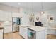Eat-in kitchen boasts granite counters, stainless appliances, and an adjacent seating area at 5078 Song Sparrow Way, Summerville, SC 29483