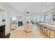 Open floor plan with fireplace, kitchen island and plenty of natural light at 5078 Song Sparrow Way, Summerville, SC 29483