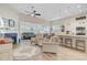 Open floor plan with fireplace, kitchen island and plenty of natural light at 5078 Song Sparrow Way, Summerville, SC 29483