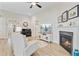 Living room features a fireplace, TV, artwork and piano at 5078 Song Sparrow Way, Summerville, SC 29483