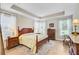 Spacious bedroom features a tray ceiling, wood floors, and a large window providing ample natural light at 5078 Song Sparrow Way, Summerville, SC 29483