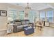 Bright sitting area featuring a sofa, chair, and windows at 5078 Song Sparrow Way, Summerville, SC 29483