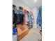 Functional walk-in closet features shelving, hanging rods, and ample storage for clothes and accessories at 5078 Song Sparrow Way, Summerville, SC 29483