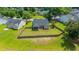 A home with a fenced-in backyard, framed by lush trees and a serene pond at 5128 Thornton Dr, Summerville, SC 29485