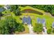 Aerial view of home and pond at 5128 Thornton Dr, complemented by mature trees and landscaping at 5128 Thornton Dr, Summerville, SC 29485