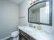 A classic bathroom with marble countertop vanity, under-mount sink, and modern fixtures at 5128 Thornton Dr, Summerville, SC 29485