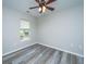 Empty bedroom with wood-look flooring, neutral wall paint and a window at 5128 Thornton Dr, Summerville, SC 29485