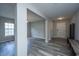 Inviting foyer featuring wood look flooring and neutral paint that flows into the living areas at 5128 Thornton Dr, Summerville, SC 29485