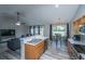 Modern kitchen with stainless steel appliances, ample counter space, and seamless transition to dining area and living room at 5128 Thornton Dr, Summerville, SC 29485