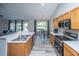 Well-equipped kitchen with stainless steel appliances, hard surface flooring, and a seamless flow to the living spaces at 5128 Thornton Dr, Summerville, SC 29485