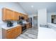 Well-lit kitchen boasting stainless steel appliances, wooden cabinets, and ample counter space at 5128 Thornton Dr, Summerville, SC 29485
