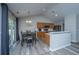 Open concept kitchen and dining area with wood floors and sliding glass door to outdoor area at 5128 Thornton Dr, Summerville, SC 29485