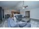 Inviting living room with a fan and hard surface floors, seamlessly connecting to the kitchen and dining area at 5128 Thornton Dr, Summerville, SC 29485