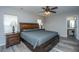 Relaxing main bedroom features a ceiling fan, wood-look flooring, and ensuite bathroom at 5128 Thornton Dr, Summerville, SC 29485