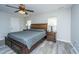 Bright main bedroom with a ceiling fan, wood-look flooring and large windows at 5128 Thornton Dr, Summerville, SC 29485