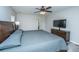 Spacious main bedroom with wood-look flooring, a ceiling fan and large dresser with television at 5128 Thornton Dr, Summerville, SC 29485