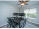 Bright office with wood-look floors, dual monitor setup, and a rolling office chair at 5128 Thornton Dr, Summerville, SC 29485