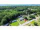 Scenic aerial view of property showcasing a house with surrounding trees and proximity to waterway at 513 Pauline Dr, Bonneau, SC 29431