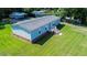 Aerial view of home with a gray roof and well-maintained lawn at 513 Pauline Dr, Bonneau, SC 29431