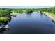 Captivating aerial view of a serene lake dotted with docks, piers and waterfront homes at 513 Pauline Dr, Bonneau, SC 29431