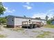 Exterior back of home with a wooden deck and stairs at 513 Pauline Dr, Bonneau, SC 29431