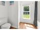Bathroom with a toilet and a window offering ample natural light at 513 Pauline Dr, Bonneau, SC 29431