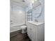 Full bathroom with a shower and bathtub combo and a white vanity with a round mirror at 513 Pauline Dr, Bonneau, SC 29431