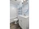 Cozy bathroom with white vanity, oval mirror, and shower-tub combination at 513 Pauline Dr, Bonneau, SC 29431