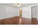Spacious bedroom with a ceiling fan and wood-look laminate flooring at 513 Pauline Dr, Bonneau, SC 29431