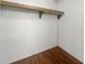 View of the closet featuring hardwood floors and a functional rack and shelf at 513 Pauline Dr, Bonneau, SC 29431