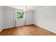 Bright dining room with hardwood floors, a chandelier, and large window at 513 Pauline Dr, Bonneau, SC 29431