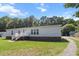 Exterior view of a single-Gathering home featuring brick foundation and a cozy front porch with white railing at 513 Pauline Dr, Bonneau, SC 29431