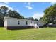 Charming home with vinyl siding, brick foundation, and a well-maintained front lawn at 513 Pauline Dr, Bonneau, SC 29431